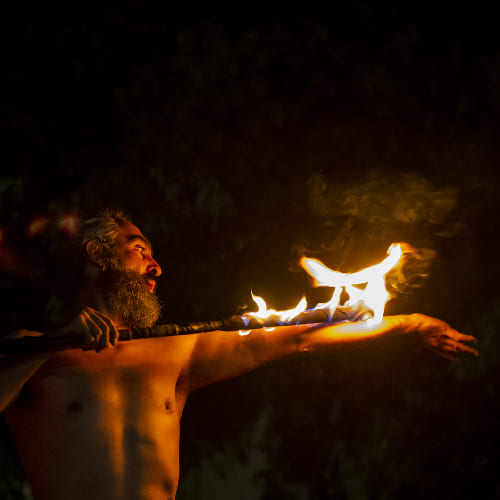 Into the fire: Miguel Rubio, nighttime shot, fire juggling in vivid colors
