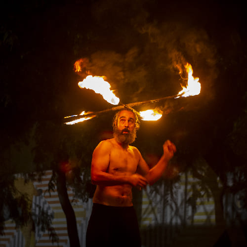 Into the fire: Miguel Rubio, nighttime shot, fire juggling in vivid colors